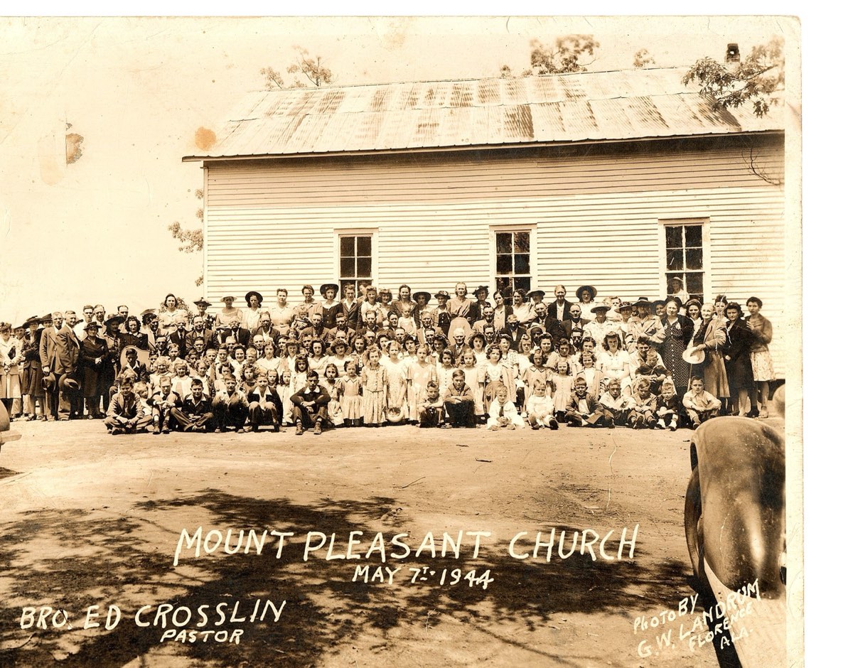 The congregation of Mount Pleasant outside the white wooden church building, 7 May 1944